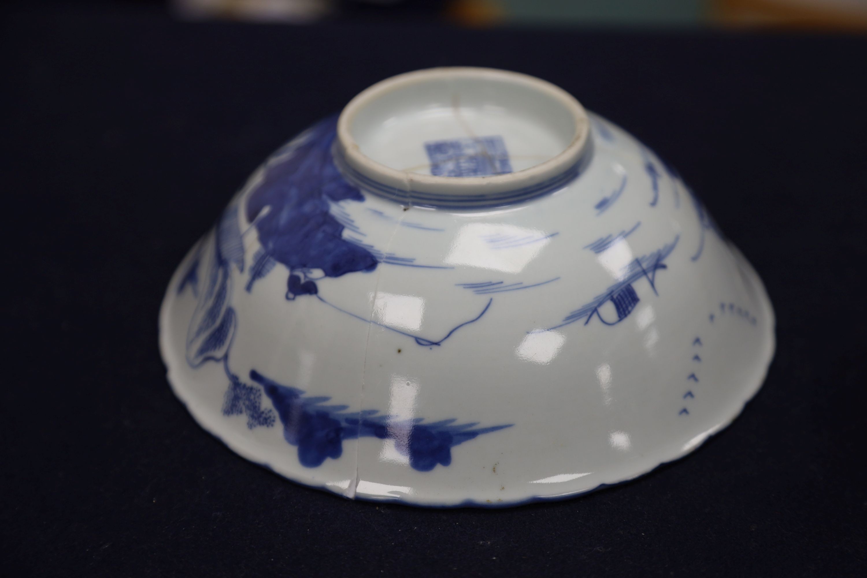 A Chinese blue and white landscape bowl, a/f and a Chinese blue and white 'dragon' dish, 18cm and 16.5cm